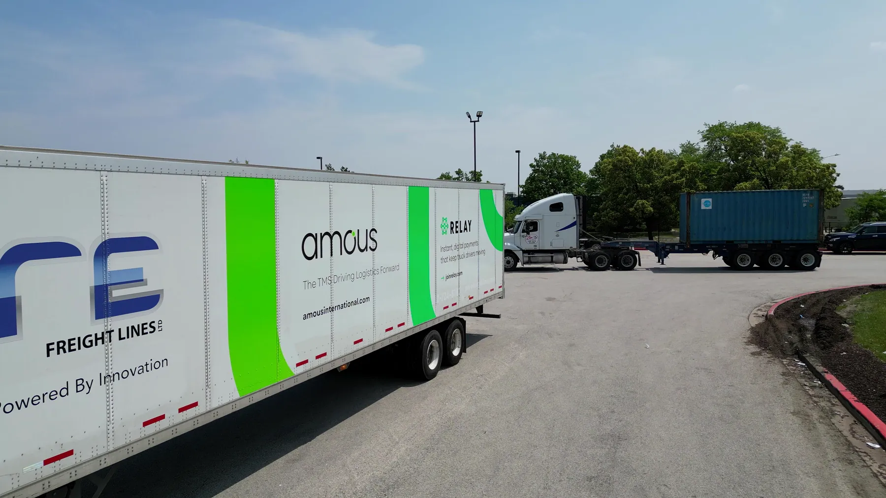 Pure trailer with Amous and Relay graphics, seen from a drone